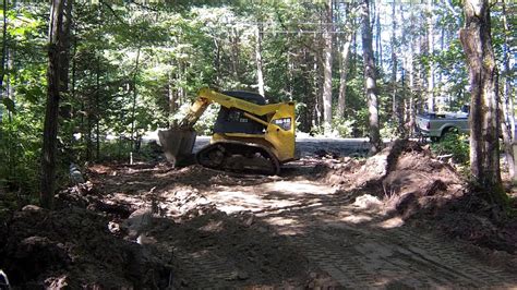 spreading pit run with a skid steer|Spreading gravel with skid steer .